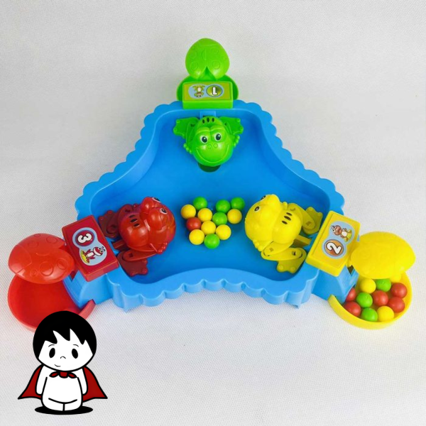 صفحه بازی گروهی قورباغه‌های گرسنه با چهار قورباغه رنگی و توپ‌ها در مرکز آن